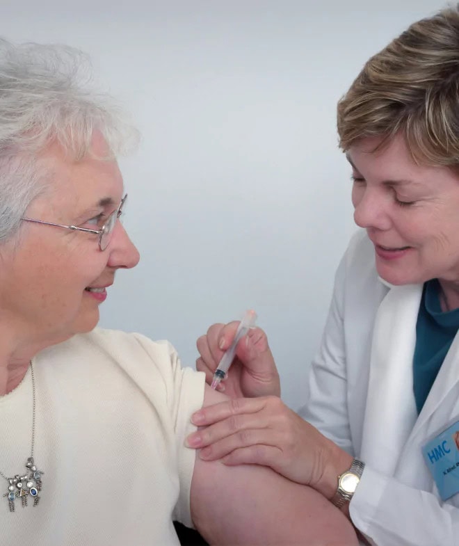 Doctor given elderly women a shot