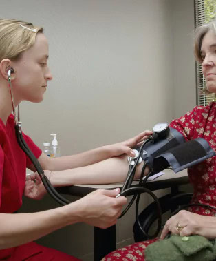 Nurse taking blood pressure